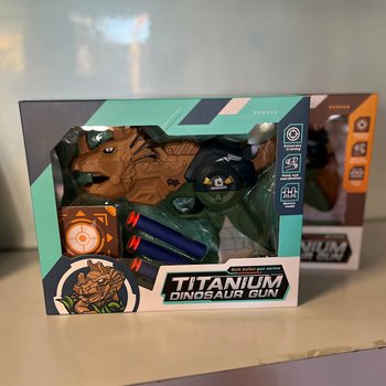 Dinozauro pistoletas su strėlėmis ir taikiniu - Dovanų dėžutė (2 vnt. rinkinys)