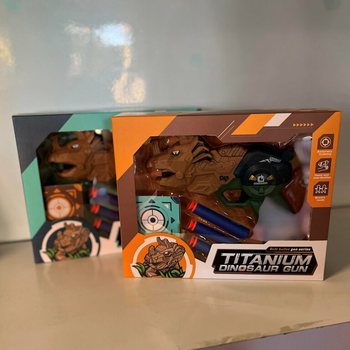 Dinozauro pistoletas su strėlėmis ir taikiniu - Dovanų dėžutė (2 vnt. rinkinys)