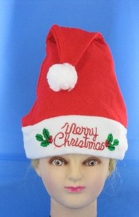 &Scaron;VIECIANTI KALĖDINĖ KEPURĖ SU UŽRA&Scaron;U "MERRY CHRISTMAS" (12 vnt.)
